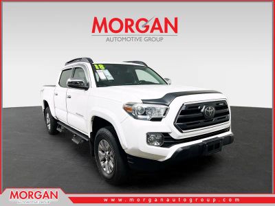 2018 Toyota Tacoma SR5 in White — front three-quarter view