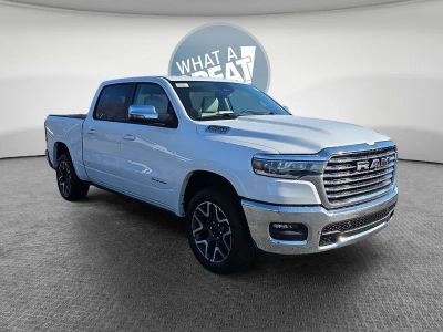 2026 RAM 1500 Laramie in Ivory White Tri-Coat Pearlcoat — front three-quarter view