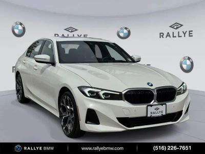 2025 BMW 3 Series 330i xDrive in Alpine White — front three-quarter view