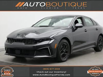 2026 Kia K5 LXS in Interstellar Gray — front three-quarter view