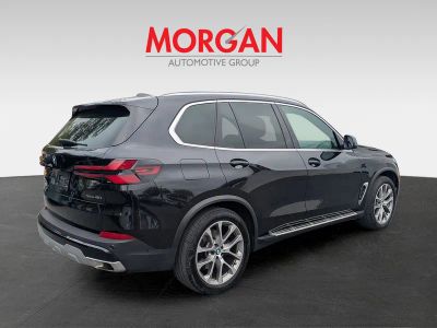 2025 BMW X5 — rear three-quarter view