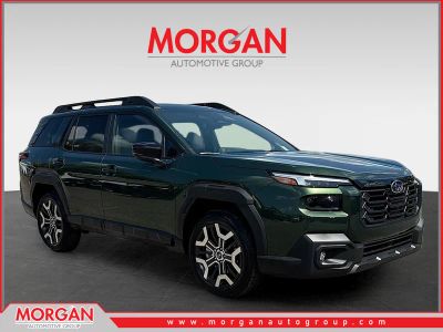 2026 Subaru Outback Touring XT in Deep Emerald Green Pearl — front three-quarter view