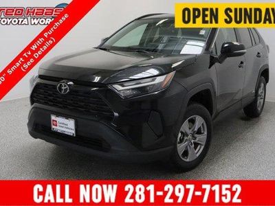 2025 Toyota RAV4 AWD Hybrid XLE 2.5L in Midnight Black Metallic — front three-quarter view