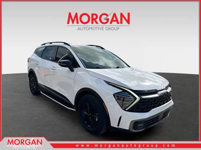 2023 Kia Sportage X-Pro Prestige in Glacial White Pearl — front three-quarter view