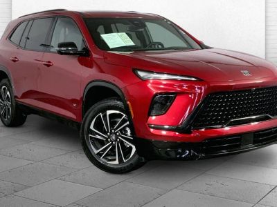 2026 Buick Enclave Sport Touring in Cherry Red Tintcoat — front three-quarter view