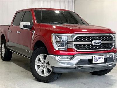 2022 Ford F-150 in Rapid Red Metallic Tinted Clearcoat — front three-quarter view