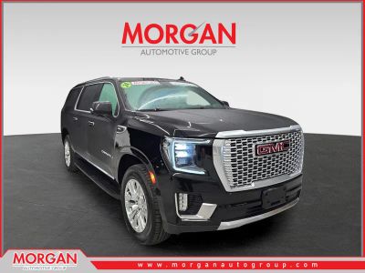 2024 GMC Yukon XL Denali in Onyx Black — front three-quarter view