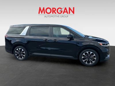 2024 Kia Carnival — rear three-quarter view