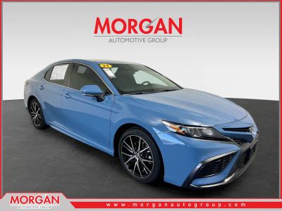 2023 Toyota Camry SE in Cavalry Blue — front three-quarter view