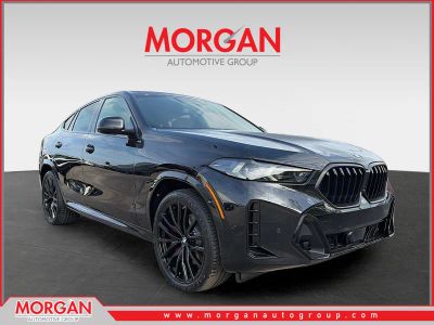 2026 BMW X6 xDrive40i in Black Sapphire Metallic — front three-quarter view
