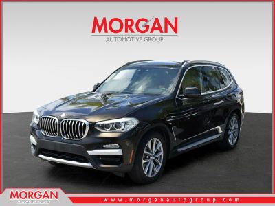 2019 BMW X3 sDrive30i in Dark Olive Metallic — front three-quarter view