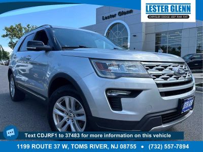 2018 Ford Explorer XLT in Ingot Silver — front three-quarter view