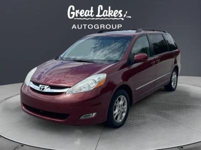 2006 Toyota SIENNA XLE in Salsa Red Pearl — front three-quarter view