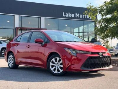 2020 Toyota Corolla LE in Barcelona Red Metallic — front three-quarter view