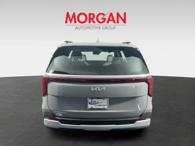 2026 Kia Carnival — rear three-quarter view