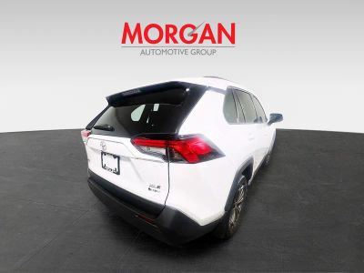 2025 Toyota RAV4 Hybrid — rear three-quarter view