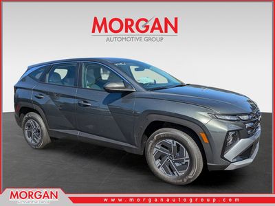 2026 Hyundai TUCSON HYBRID Blue SE in Amazon Gray — front three-quarter view