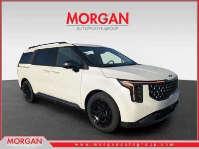 2026 Kia Carnival Hybrid SX Prestige in Snow White Pearl — front three-quarter view