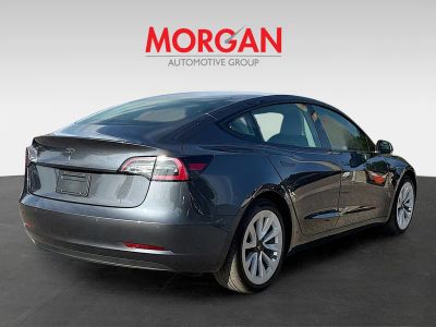 2021 Tesla Model 3 — rear three-quarter view