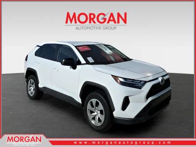 2023 Toyota RAV4 LE in White — front three-quarter view
