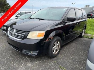 2008 Dodge Grand Caravan SXT in Brilliant Black Crystal Pearlcoat — front three-quarter view