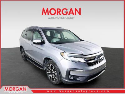 2019 Honda Pilot Touring in Lunar Silver Metallic — front three-quarter view