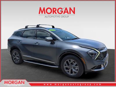 2024 Kia Sportage Hybrid SX-Prestige in Shadow Matte Gray — front three-quarter view