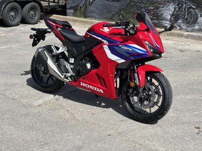 2025 Honda CBR500R in GRAND PRIX RED — front three-quarter view