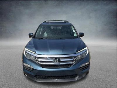 2017 Honda Pilot EX-L in Steel Sapphire Metallic — front three-quarter view