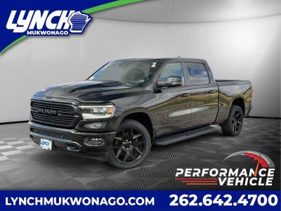 2023 RAM 1500 Laramie Night Edition w/Moonroof in Diamond Black Crystal Pearlcoat — front three-quarter view