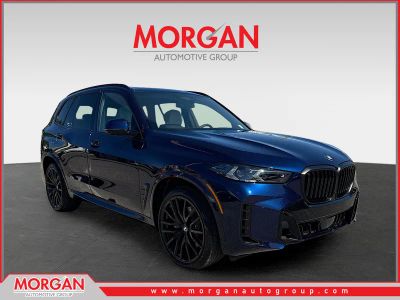 2026 BMW X5 sDrive40i in Tanzanite Blue II Metallic — front three-quarter view