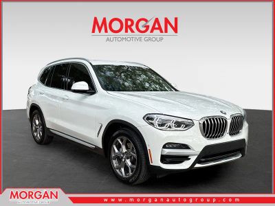 2021 BMW X3 sDrive30i in Alpine White — front three-quarter view