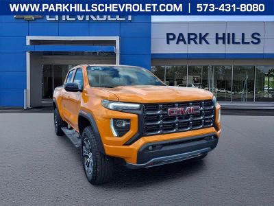 2025 GMC Canyon AT4 in Desert Sun — front three-quarter view