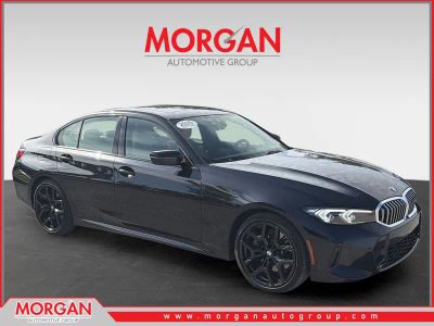 2025 BMW 3 Series 330i xDrive in Black — front three-quarter view
