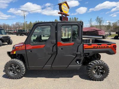 2026 Polaris Ranger Crew XP 1000 NorthStar Edition Premium R26RSU99AF in Orange Rust — front three-quarter view