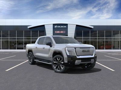 2024 GMC Sierra EV Denali Edition 1 in Thunderstorm Gray — front three-quarter view