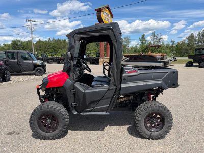 2021 Honda Pioneer 700 Deluxe SXS700M2DM in Pearl Red — front three-quarter view