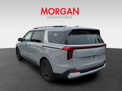2026 Kia Carnival Hybrid — rear three-quarter view
