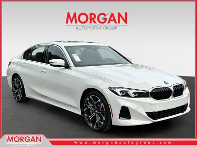 2025 BMW 3 Series 330i in Alpine White — front three-quarter view