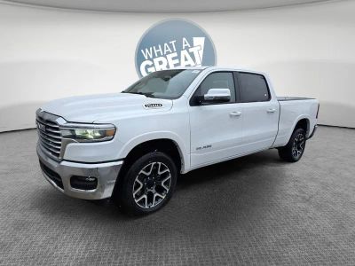 2026 RAM 1500 Laramie in Ivory White Tri-Coat Pearlcoat — front three-quarter view