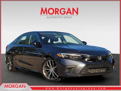 2023 Honda Civic Sedan Touring in Meteorite Gray Metallic — front three-quarter view