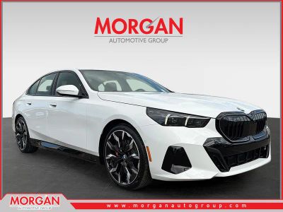 2026 BMW 5 Series 530i in Alpine White — front three-quarter view