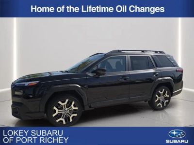 2026 Subaru Outback Touring XT in Crystal Black Silica — front three-quarter view