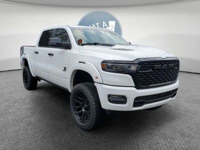 2026 RAM 1500 RAM 1500 BIG HORN CREW CAB 4X4 5'7' BOX in Bright White Clear-Coat Exterior Paint — front three-quarter view