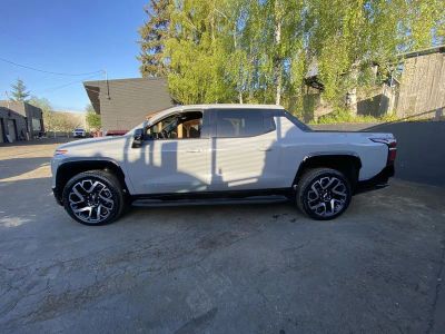 2025 Chevrolet Silverado EV — rear three-quarter view