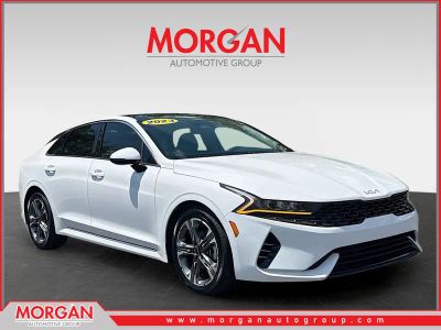 2023 Kia K5 EX in Glacial White Pearl — front three-quarter view