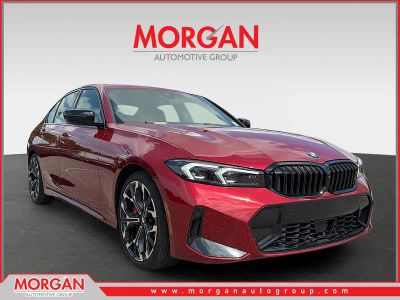 2025 BMW 3 Series 330i in Red Metallic — front three-quarter view