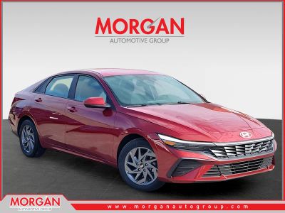 2024 Hyundai Elantra SEL in Red — front three-quarter view