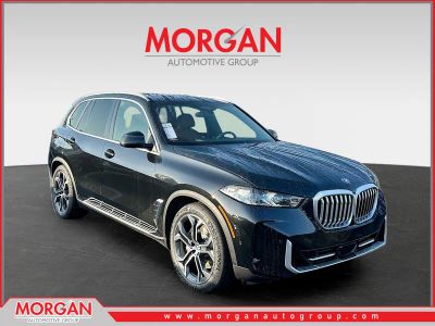 2026 BMW X5 xDrive50e in Black — front three-quarter view