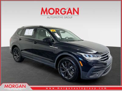 2024 Volkswagen Tiguan 2.0T SE in Deep Black Pearl — front three-quarter view